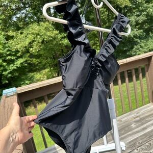 One piece swim suit with padded bust.